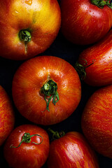 Juicy seasonal fragrant red tomatoes close-up