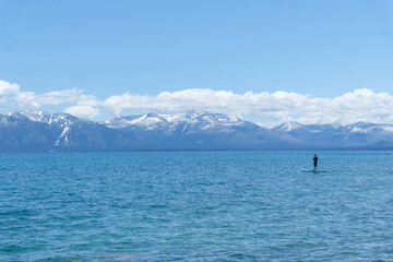 Sugar Pine Point Beach on Lake Tahoe with a paddle boarder on the peaceful lake