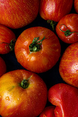 Juicy seasonal fragrant red tomatoes close-up