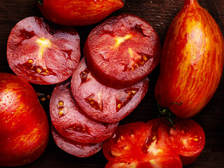 Juicy seasonal fragrant red tomatoes close-up
