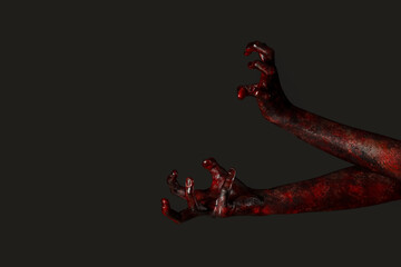 Hands of zombie on black background. Halloween celebration