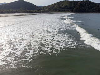 hundreds of surfers waiting for a perfect wave