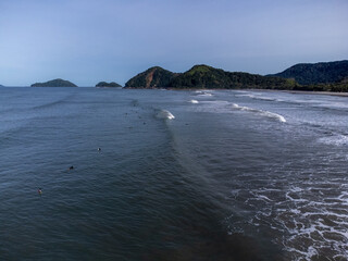 hundreds of surfers waiting for a perfect wave