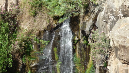 a waterfall in the mountains.Waterfall in the mountains of Crete, Greece. Summer landscape