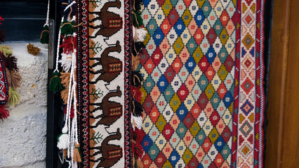 Manufacturing process, weaving of a traditional wool oriental red carpet with an intricate floral...