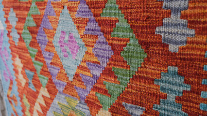 Manufacturing process, weaving of a traditional wool oriental red carpet with an intricate floral...