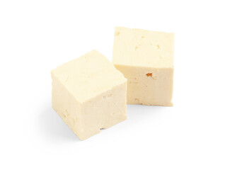 Pieces of tasty tofu cheese isolated on white background, closeup