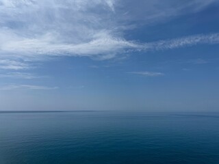 Sea blue calm water and blue sky.