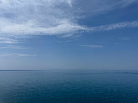 Sea blue calm water and blue sky.