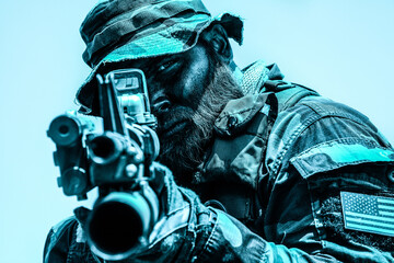 Soldier wearing camouflage and helmet aiming a rifle with intense focus, an American flag patch visible on uniform, set against a bright sky.
