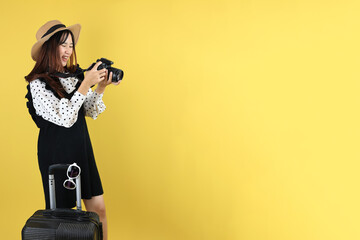 Young Female Traveller Smiling While Review Photo on Her Camera