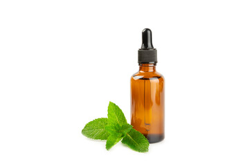 Essential oil mint isolated on white background. Peppermint essential oil with fresh mint leaves. A bottle of aromatherapy oil. Mint extract. The concept of natural cosmetics, spa care