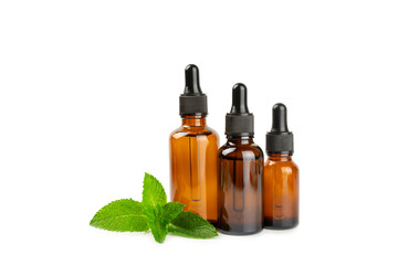 Essential oil mint isolated on white background. Peppermint essential oil with fresh mint leaves. A bottle of aromatherapy oil. Mint extract. The concept of natural cosmetics, spa care