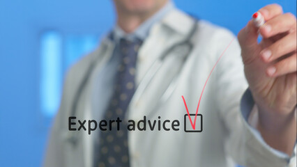 Doctor wearing a lab coat and stethoscope marking a checkbox next to the words expert advice displayed on a virtual screen, representing professionalism in healthcare and medical consultation
