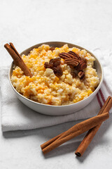 Rice millet porridge with pumpkin and cinnamon. Healthy breakfast