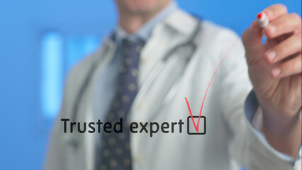 Medical professional ticking a checkbox next to the words trusted expert written on a transparent...
