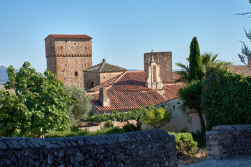 Access to the charming old town of Trujillo, with its ancient stone towers and tiled roofs under a...