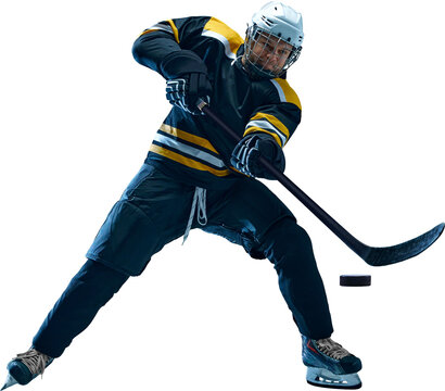 Professional male hockey athlete prepares powerful slapshot with full body twist and lifted puck, wearing black and yellow uniform. Concept of winter sport promotion, sports branding and marketing