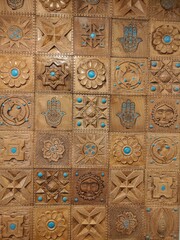 Ornamental wooden wall panel with traditional carvings and patterns