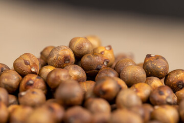 fried but not boiled chickpeas are on the table with a tablecloth, closeup