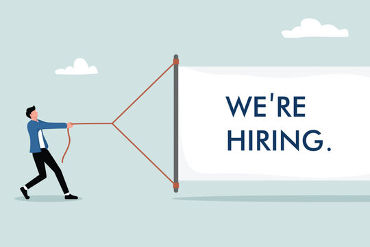 Businessman pulls a white banner with the text "we are hiring". The concept of recruitment in business.