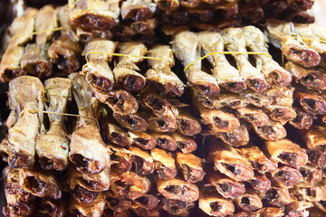 Thai cuisine. Grilled smoked fish tied in bundles for sale