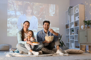 Family during watching of movie together at home