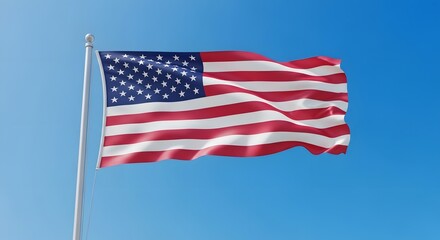 American flag billowing proudly in a clear blue sky.