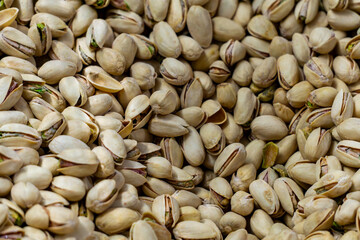 roasted pistachios in shells, arranged in a dense composition