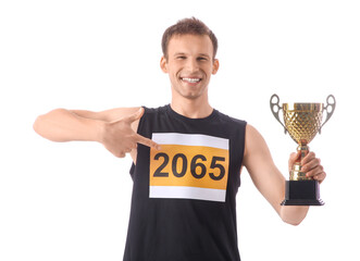 Sporty young man with gold cup after running marathon on white background