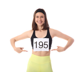 Sporty young woman pointing at her marathon number on white background