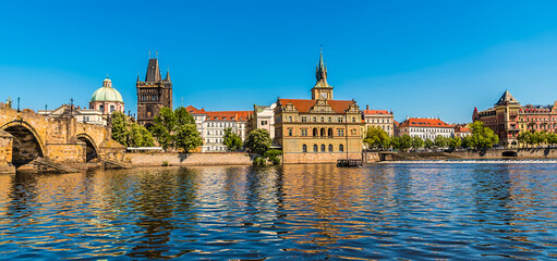 A view from the Vltava river looking back towards the Charles Bridge in Prague in springtime