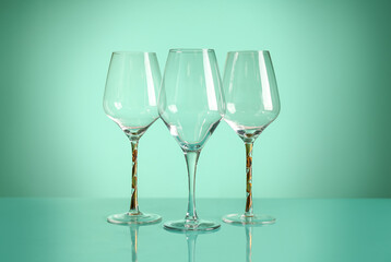Wine glasses on turquoise background
