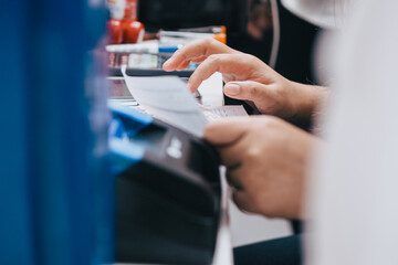 close up of cashier's hand counting