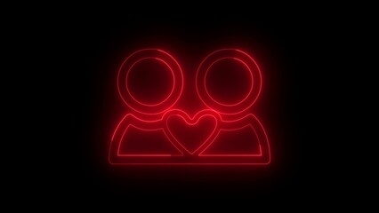 Glowing red neon silhouette of two people with a heart shape symbolizing love and connection against black background