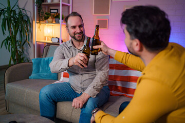 Friends celebrate a special occasion with drinks at home