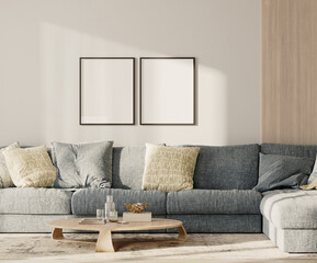 Two blank frames in lounge interior with blue sofa and table with wooden panel on the wall, 3d render