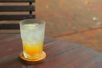 A glass of tropical ice drink for summer. Consist of passionfruit juice, lime juice, mint and soda....