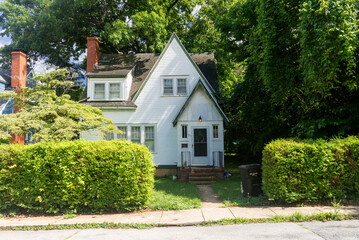 Traditional American house with a green lawn. old style.