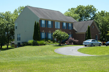 house in a suburb in Virginia. Gorgeous landscape with single family home with lawn.