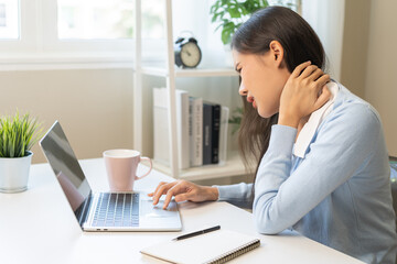Body muscles stiff problem, ache asian young woman, girl pain neck while sitting work on chair at home, holding massaging rubbing, hurt or sore, Healthcare people, office syndrome.