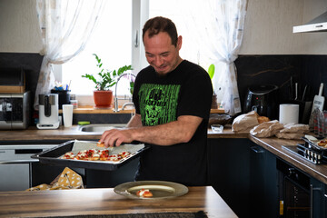 man cooking in his kitchen