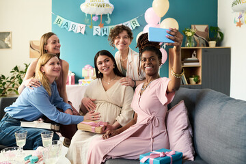 Group of young adult and middle aged multiethnic women celebrating gender reveal party, smiling and...