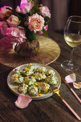 romantic dinner with flowers in the kitchen