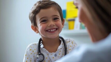 Smiling boy with stethoscope appears to be at a medical appointment