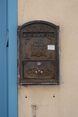 Aged and rusty mailbox on a white wall in Neve Tzedek Neighbourhood in Tel Aviv, Israel 