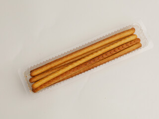 Long biscuit or sweet crackers stick on white background