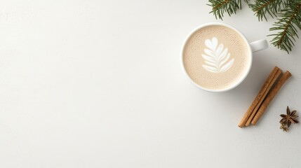 Flat lay of a festive latte with leaf latte art, cinnamon sticks, star anise, and pine branches on a white background. A cozy and minimal winter coffee scene perfect for seasonal designs.