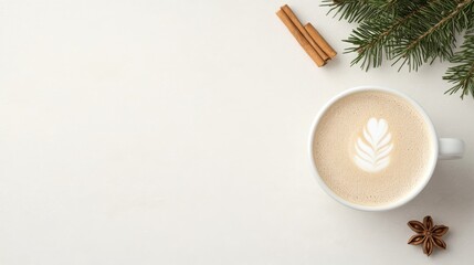 Flat lay of a festive latte with leaf latte art, cinnamon sticks, star anise, and pine branches on a white background. A cozy and minimal winter coffee scene perfect for seasonal designs.