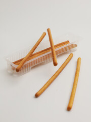 Long biscuit or sweet crackers stick on white background